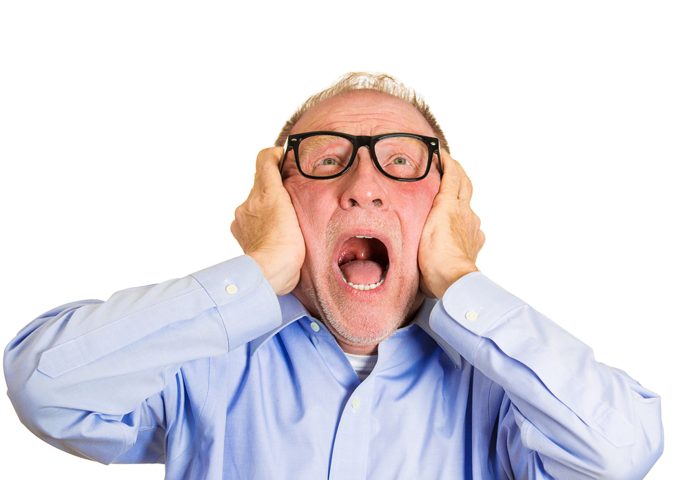 Closeup portrait, angry senior man, nerd black glasses, covering ears, looking up, to say, stop making that loud noise it's giving me a headache, isolated white background. Negative human emotion-2