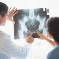 Nurse and doctor examining xray in hospital