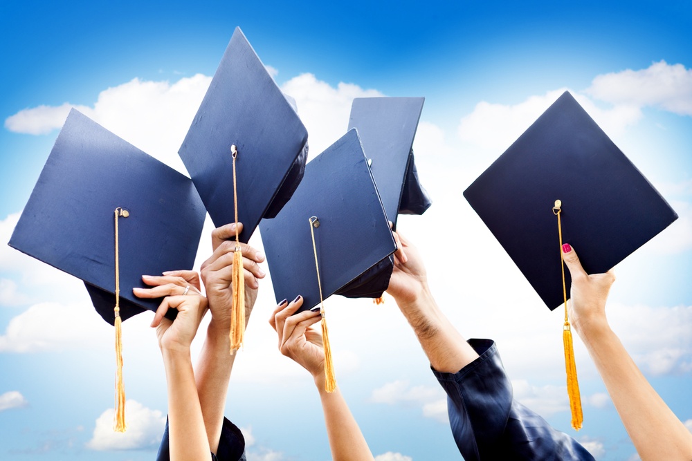 Unrecognizable group of people throwing graduations hats in the air.jpeg Unrecognizable group of people throwing graduations hats in the air.jpeg
